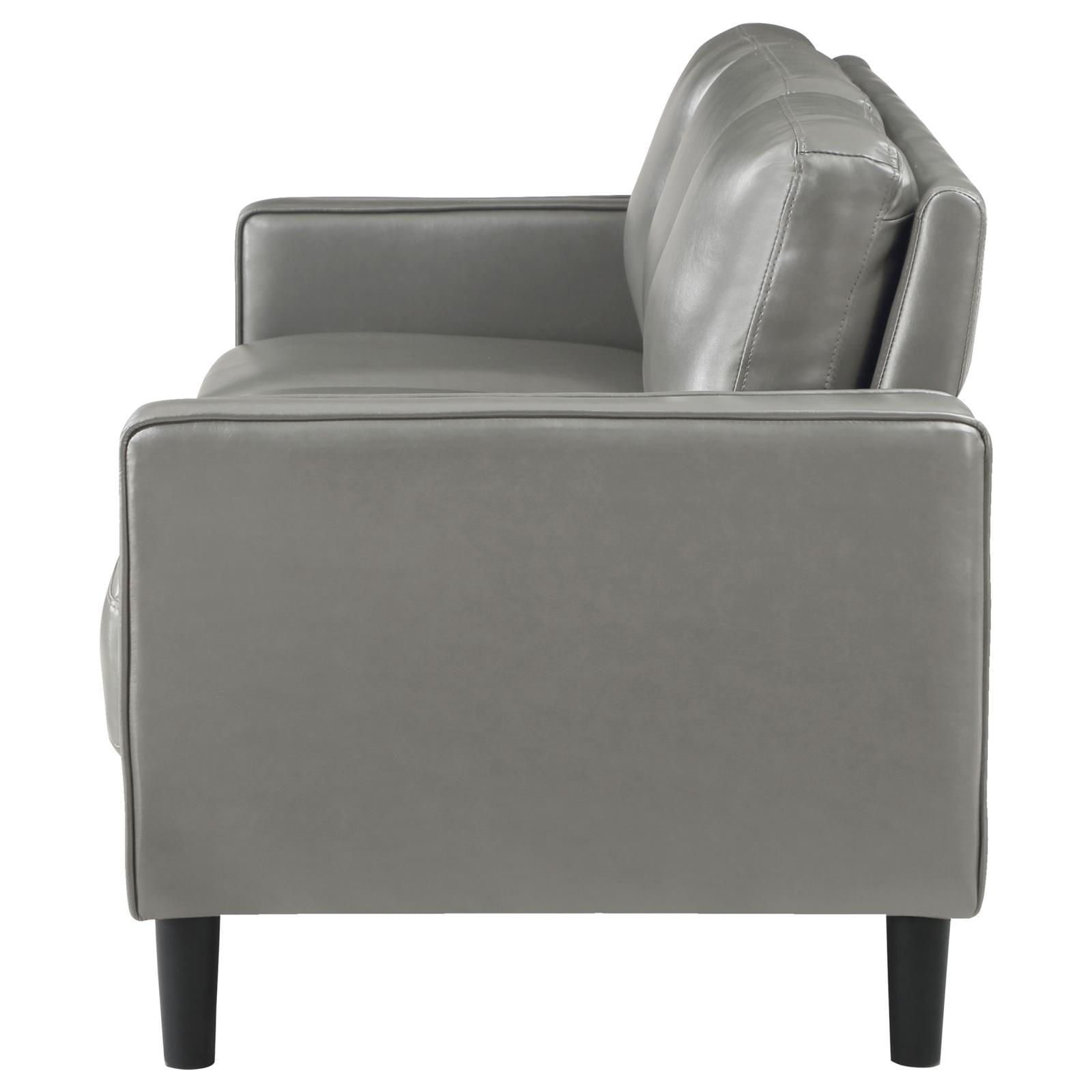side angle of Ruth grey faux leather sofa showing seat cushions