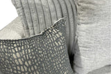 Close-up detail of black fabric upholstery on Rivera set