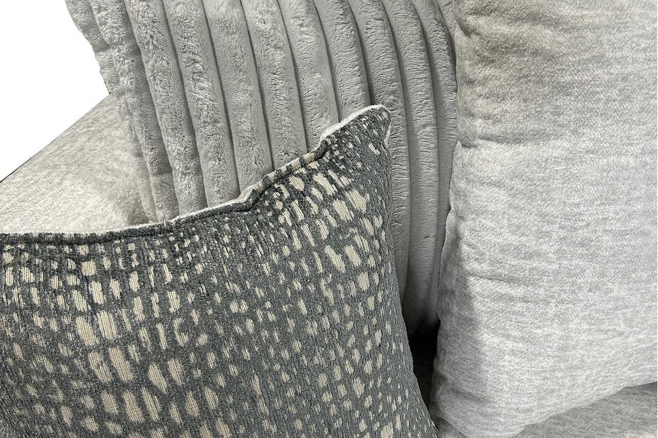 Close-up detail of black fabric upholstery on Rivera set