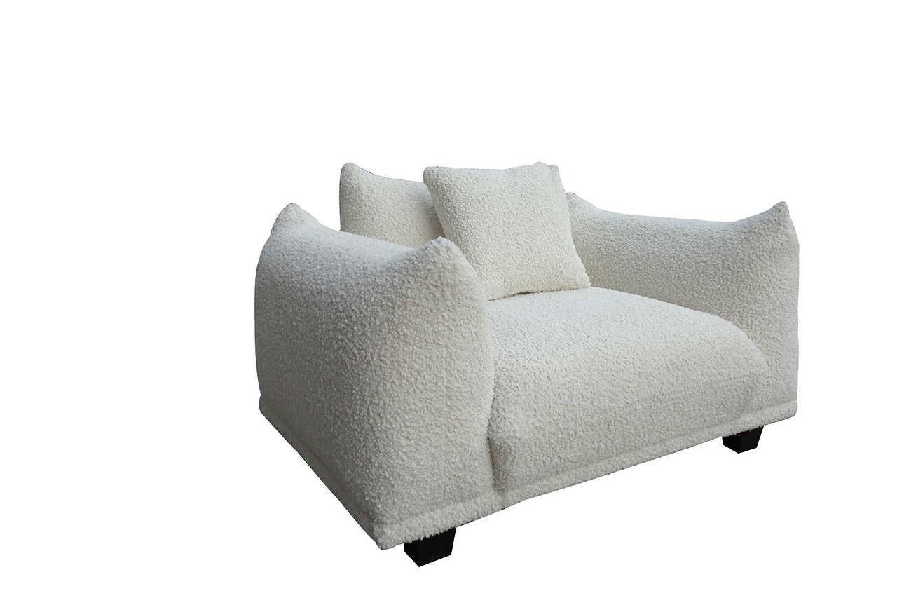 Side view showing armrest and cushion detail
