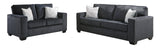 Close-up of Ashley Slate Fabric Upholstered Living Room Set fabric and frame detail