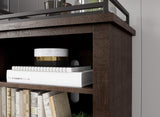 Close-up of Arlenbry Large Brown TV Stand cabinet and drawer detail