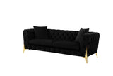 Close-up detail of black velvet upholstery and gold legs on Star set