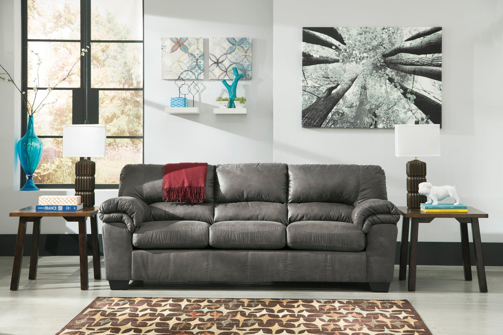 Bladen Slate Full Size Sleeper Sofa side angle in slate faux leather