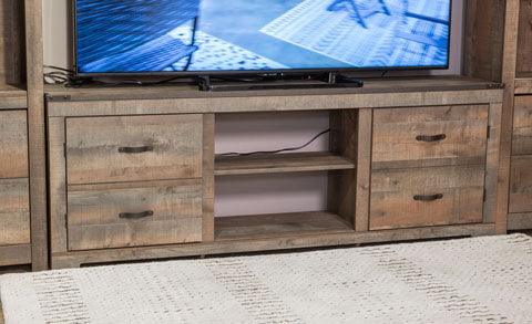 Close-up of Trinell brown rustic solid wood TV stand fireplace insert and cabinet doors
