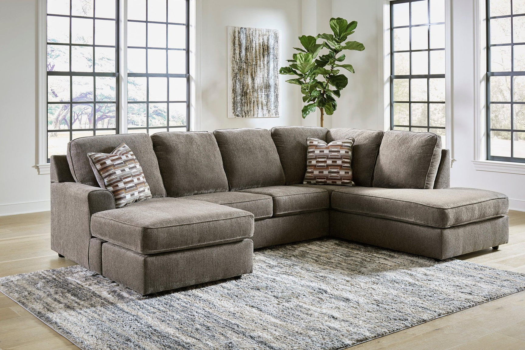 Side view of Ashley Putty Fabric Upholstered Sectional sofa