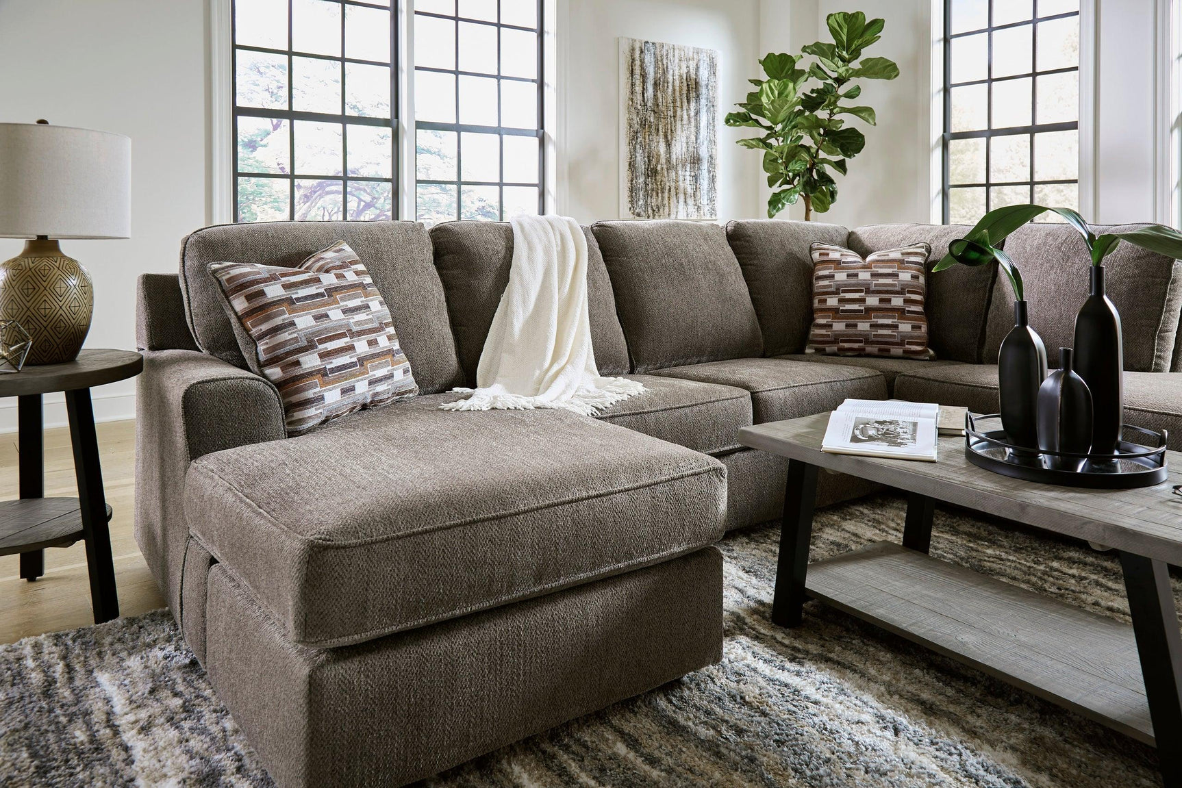 Detail of Ashley Putty Fabric Upholstered Sectional sofa cushions and fabric