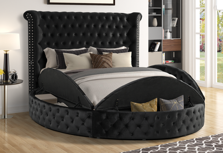 Penthouse black velvet king bed angled view showing tufted headboard and USB port