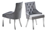 Close-up detail of marble tabletop and chair upholstery in gray