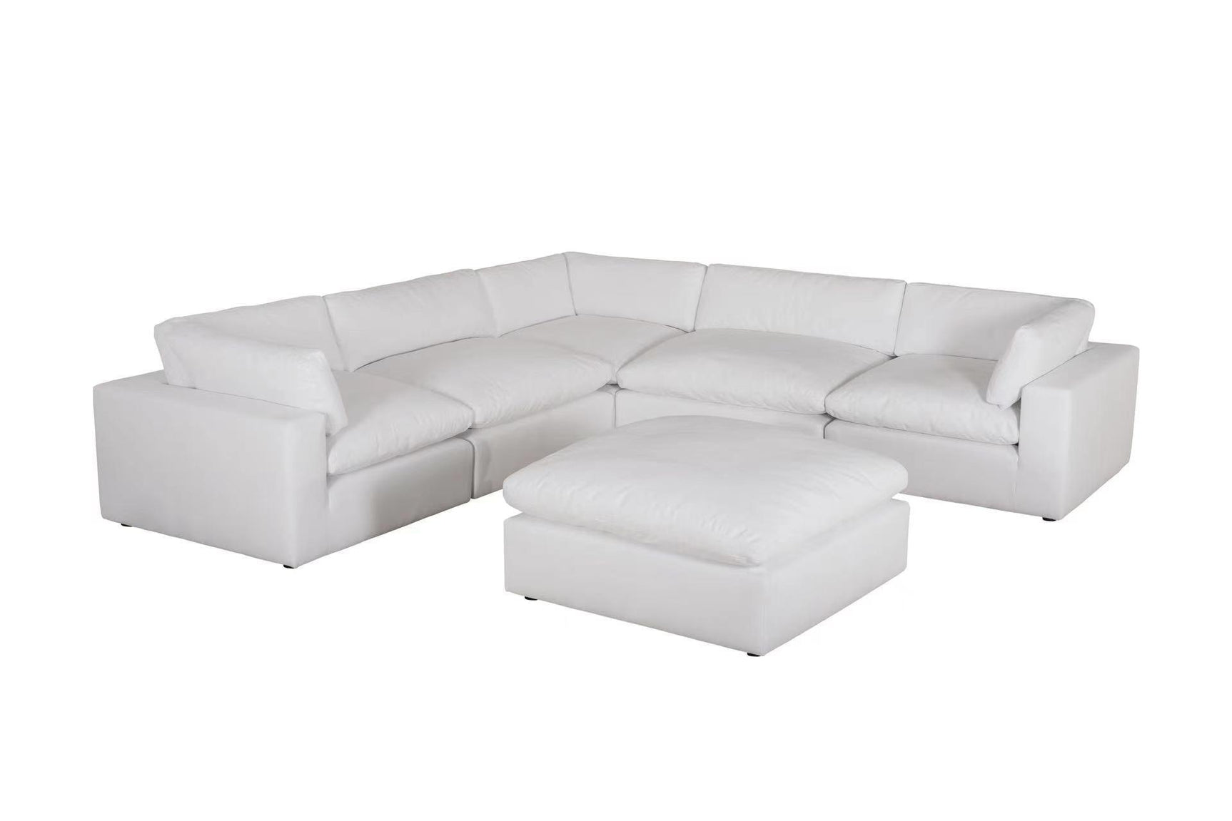 Room view featuring XL Cloud White sectional sofa with ottoman