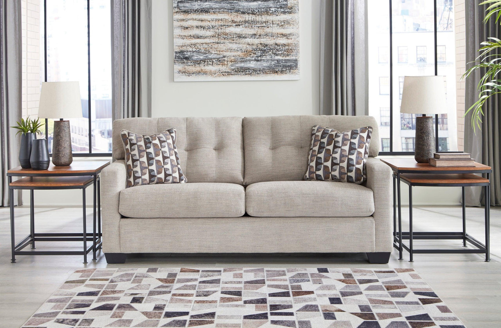 Pebble tufted sofa sleeper showcasing fabric texture and design - side view