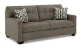 Side angle of chocolate tufted full sofa sleeper with faux fabric upholstery