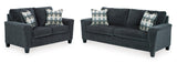 Ashley Smoke Fabric Upholstered Loveseat side angle view