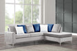 Silver velvet reversible sectional sofa with nailhead trim and fur accent pillows, front angle