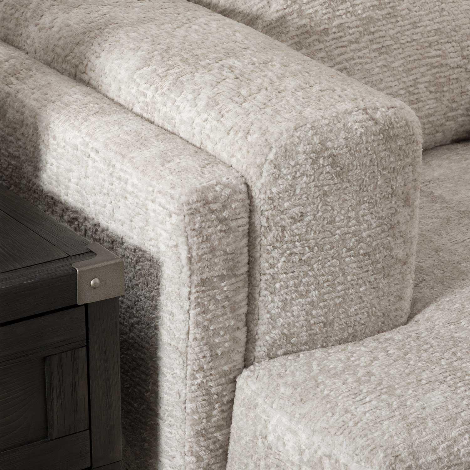 close-up detail of fabric and cushions on sand gray sectional sofa
