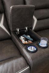 Power reclining sectional showing LED-lit cup holders and storage console