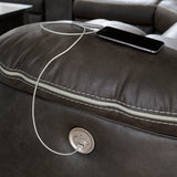 Close-up of USB charging port and power control on sectional