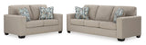 Ashley 512-04 Living Room Set loveseat side view with accent pillows