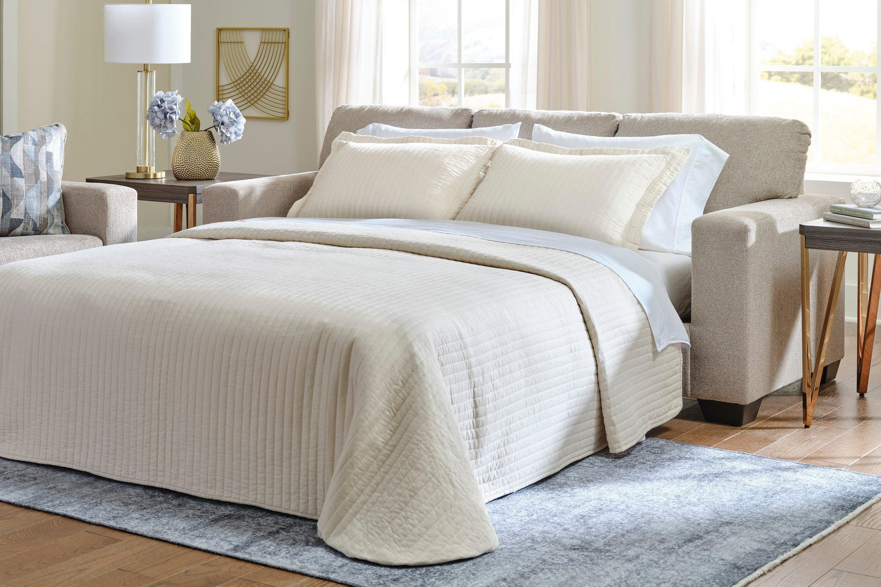 Deltona queen sleeper sofa showcasing bi-fold queen memory foam mattress