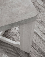 Side view of Garnilly whitewash end table with visible leg design