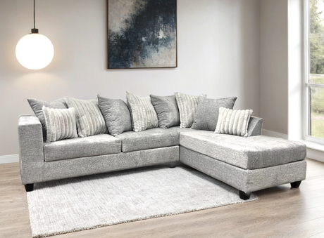 Detailed close-up of Kaf Gray sectional fabric and cushions