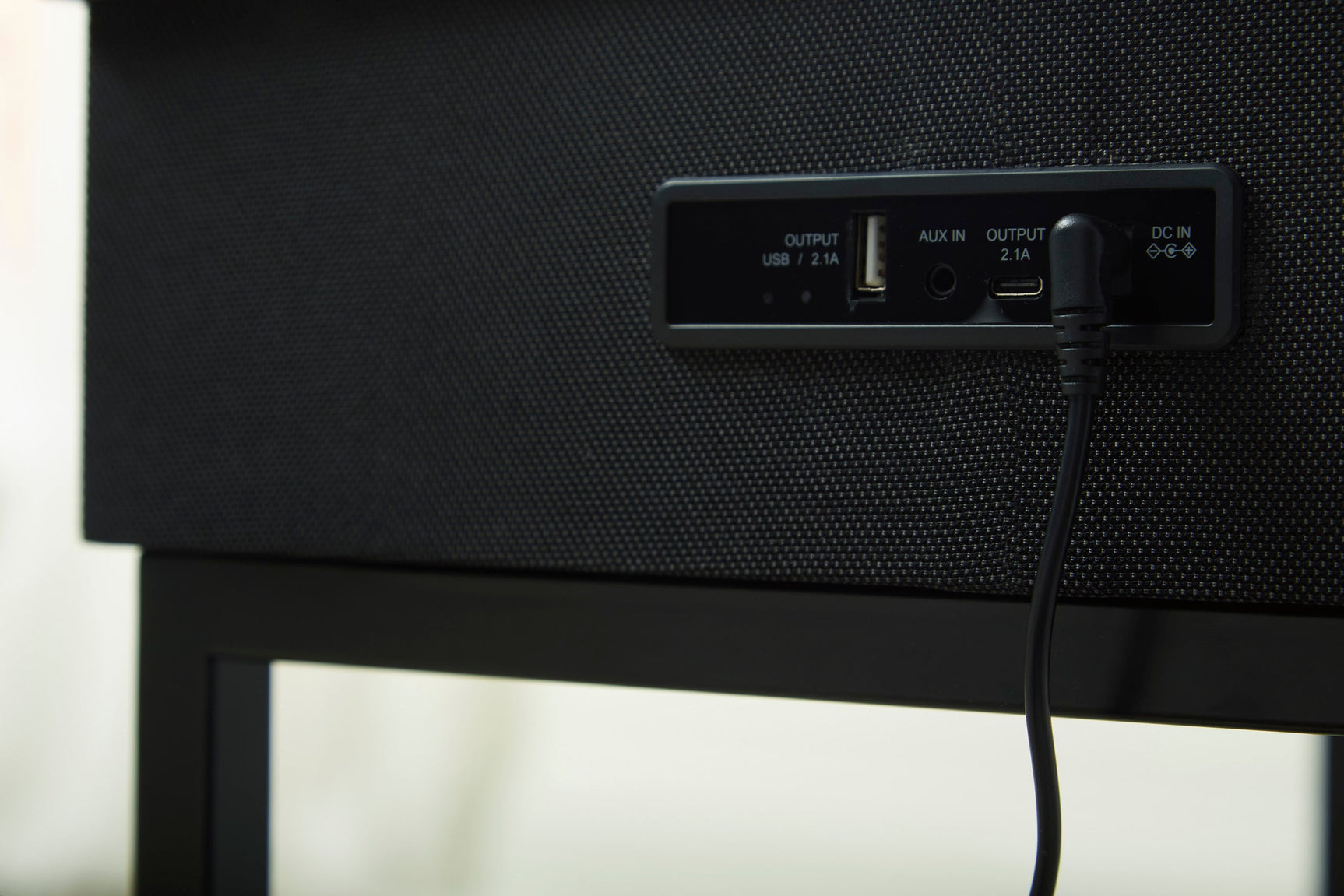Detail of glass tabletop with touch button controls and LED light effect