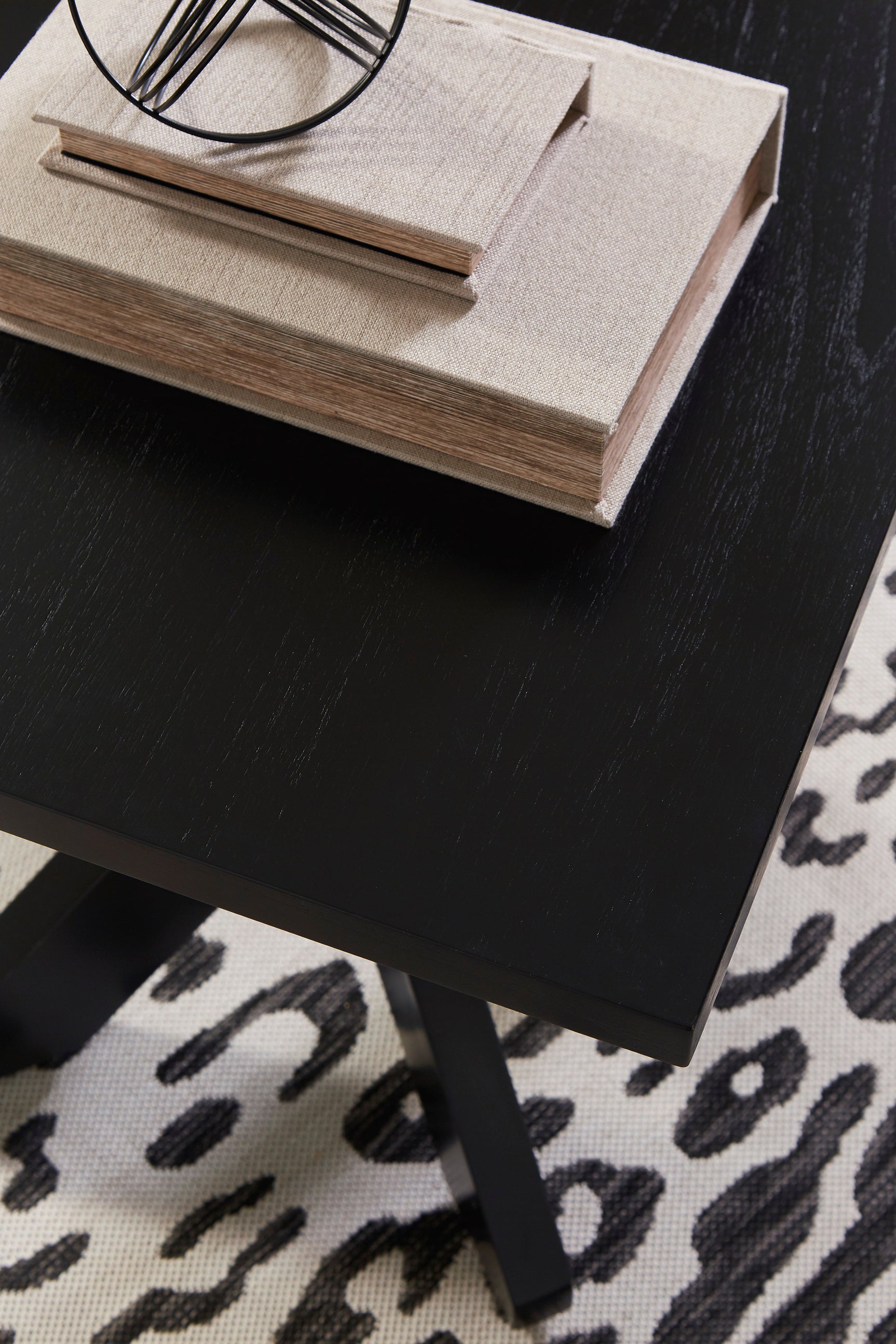 Side view of Joshyard black cocktail table