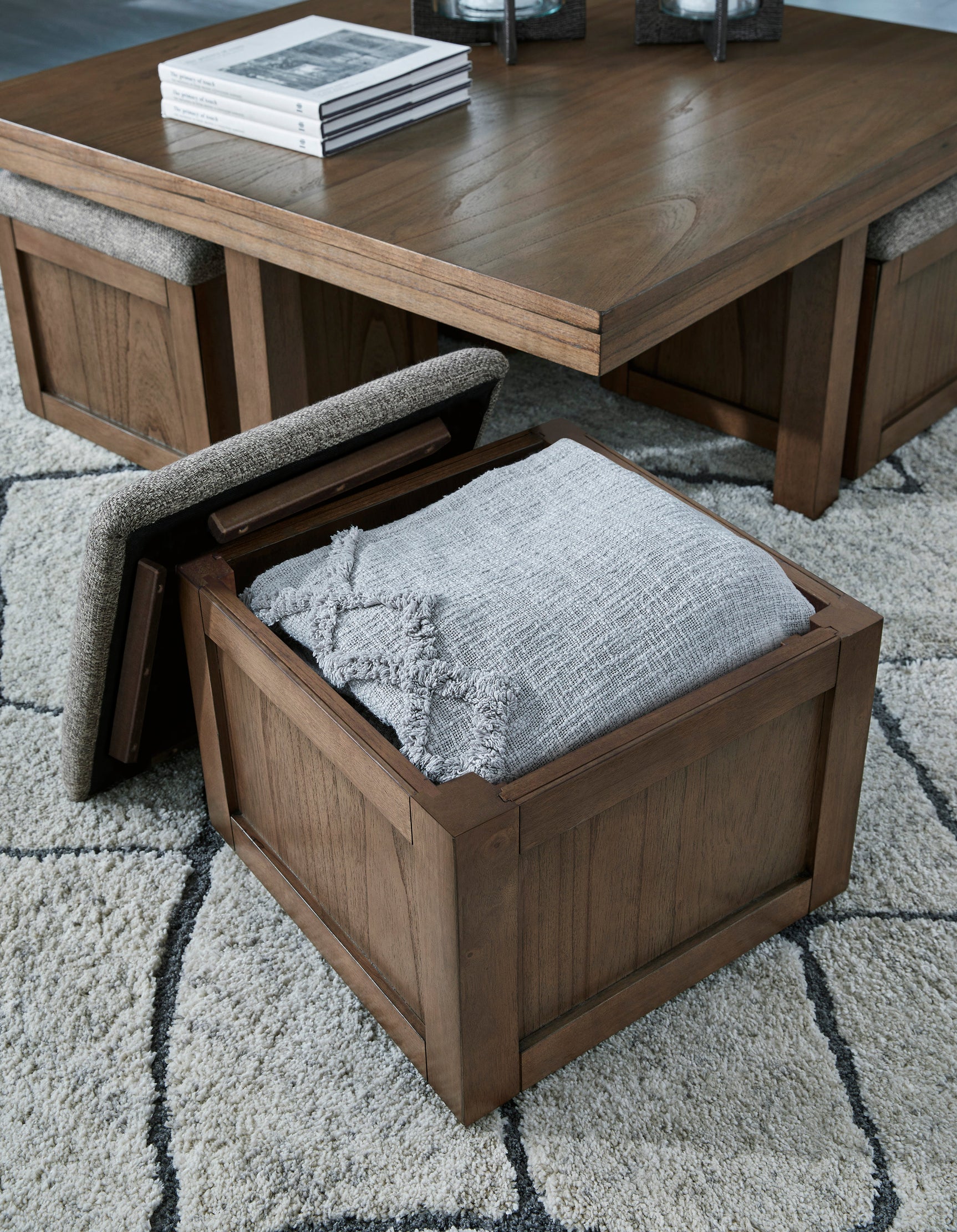 Brown cocktail table set with stools side view