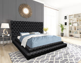 Close-up of Kiki bed tufted headboard in black velvet