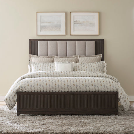 Side view of Ree Cafe Upholstered Panel Bedroom Set bed showing panel details