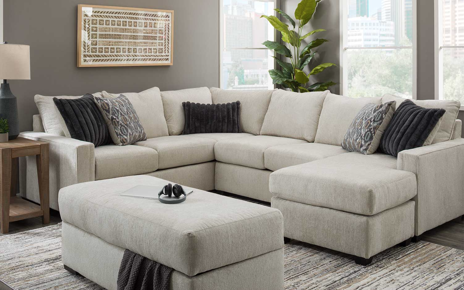 Close-up detail of stone fabric upholstery on Behold Gray Sectional