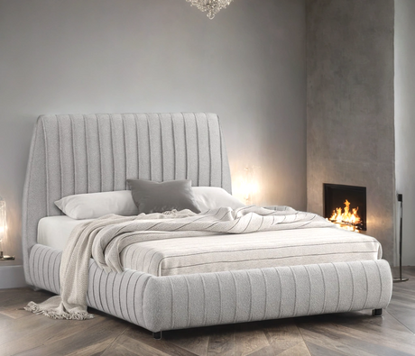 Close-up of gray boucle fabric upholstery on Oasis bed