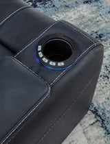 Close-up of Den Sapphire recliner LED cup holders and storage