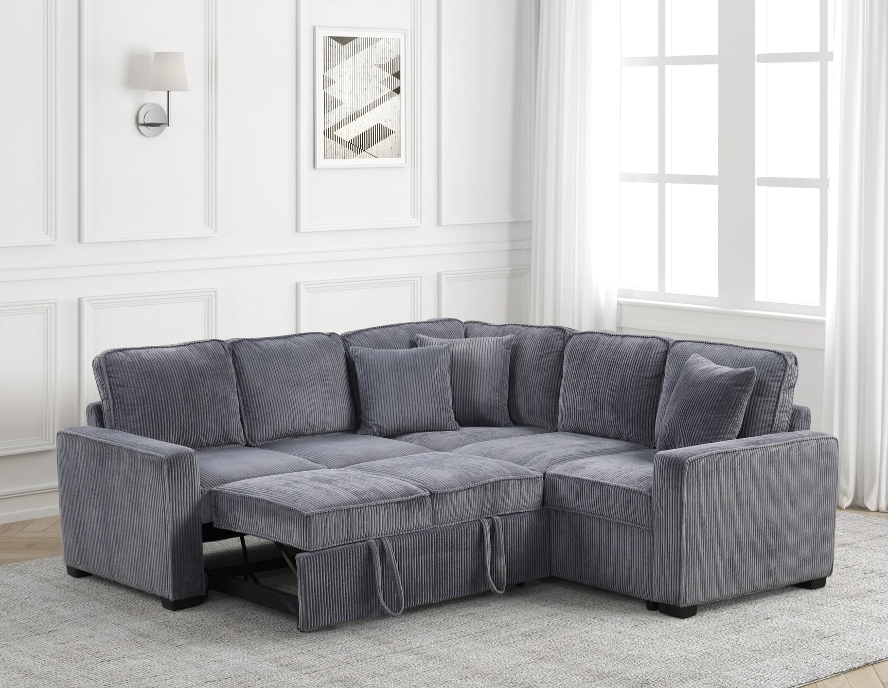Detail of Ariel charcoal sectional sofa upholstery and pull-out bed mechanism