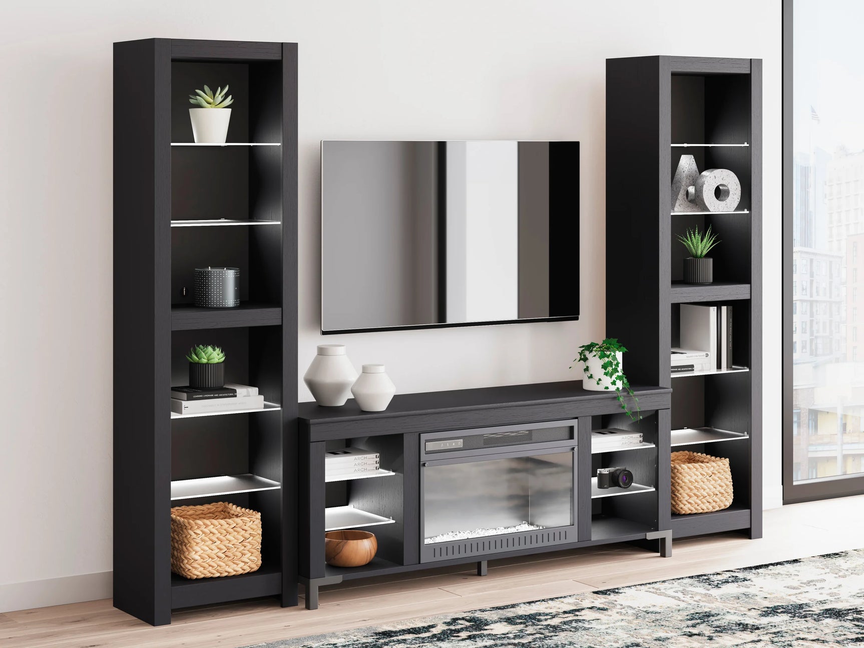 Remote control displayed next to Cayberry black TV stand