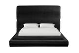 Black upholstered king platform bed in bedroom setting