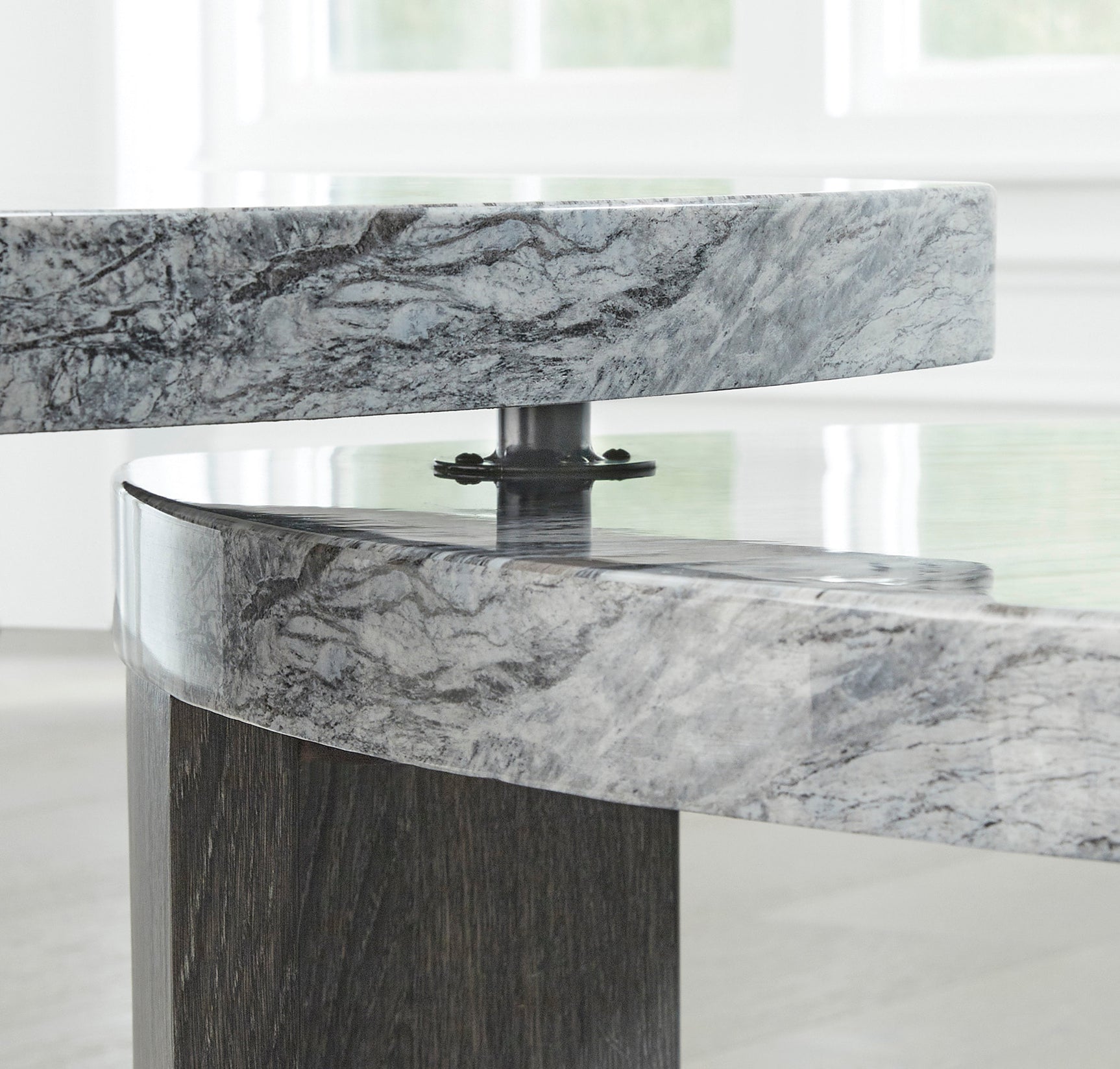 Close-up of gray and brown finish on cocktail table corner