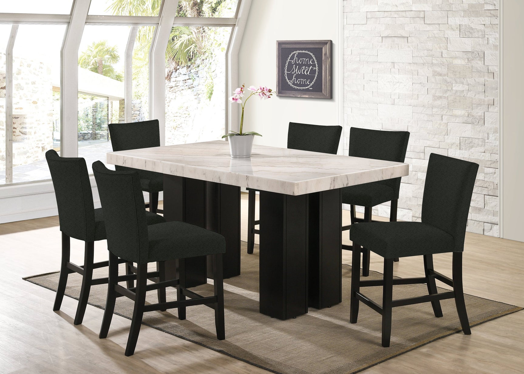 Side angle showing Finley black marble counter height dining table with six boucle chairs