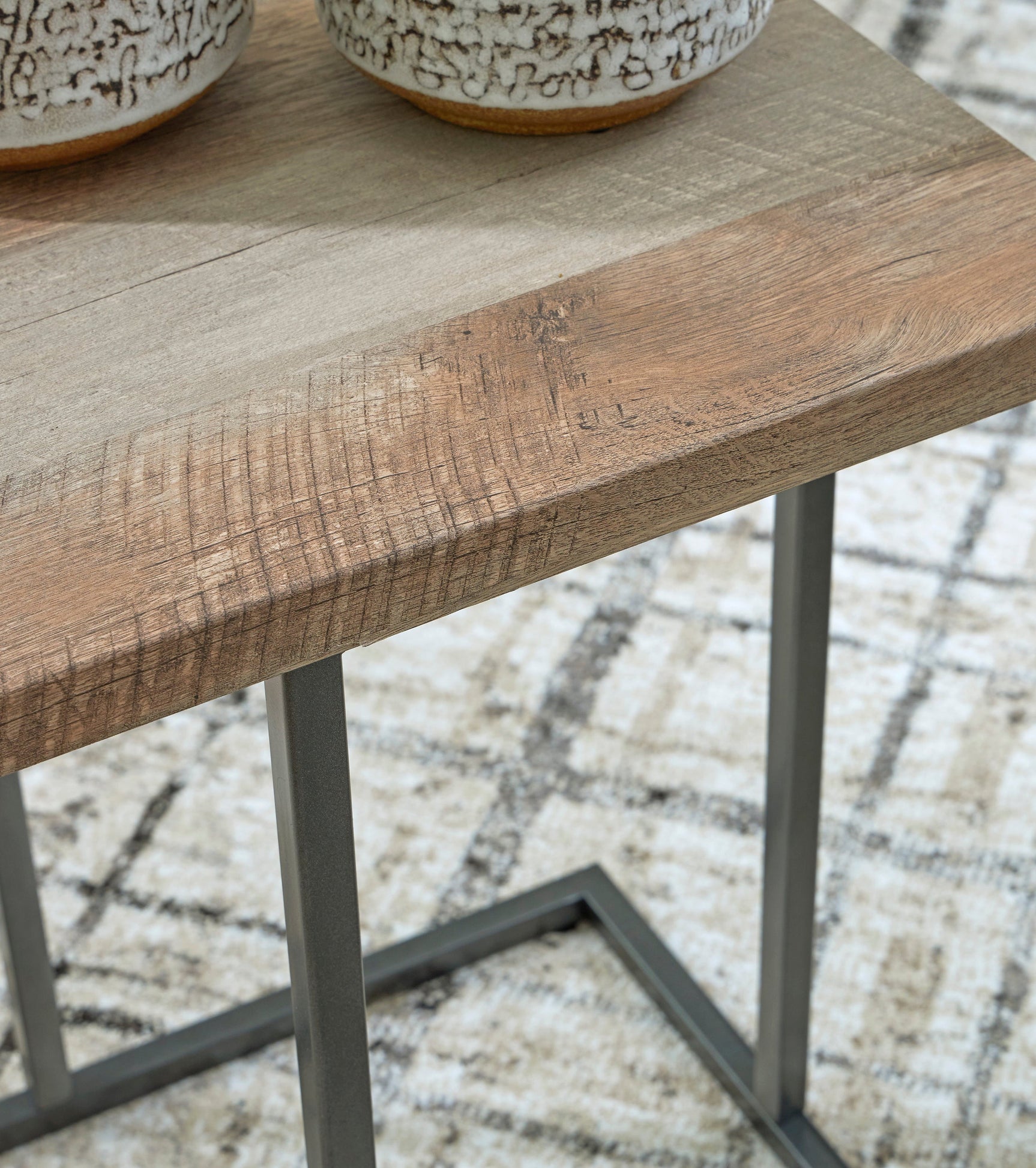 Close-up of Tumar occasional table set surface and finish