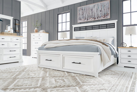 Side view of Ashbryn White Storage Platform Bedroom Set bed