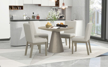 Front view of Ditu Light Gray Round Dining Table with 4 chairs set in dining room