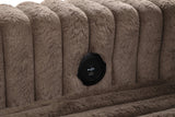Close-up detail of mocha fabric upholstery and pull-out bed mechanism