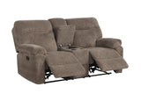 Sofa pillow and plush fabric detail in mocha color