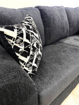 Close-up detail of chenille-like black upholstery on Tuten Living Room Set