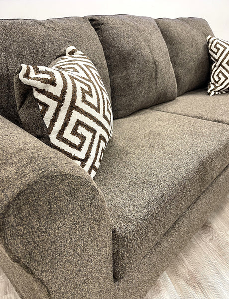 Close-up detail of chenille-like fabric on Tuten Brown Living Room Set