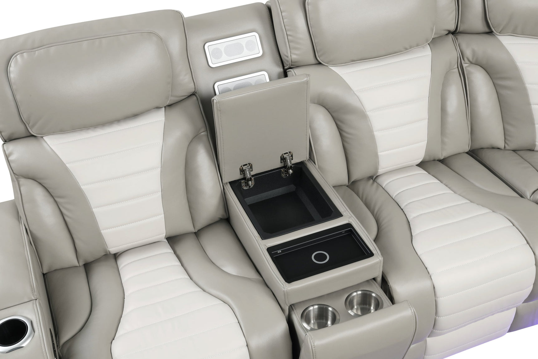 Close-up of wireless charging tray and speaker technology on Ibiza sectional