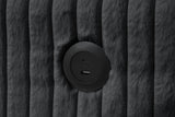 Close-up detail of black upholstery and storage chaise on July sectional sofa