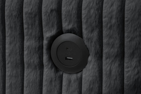 Close-up detail of black upholstery and storage chaise on July sectional sofa