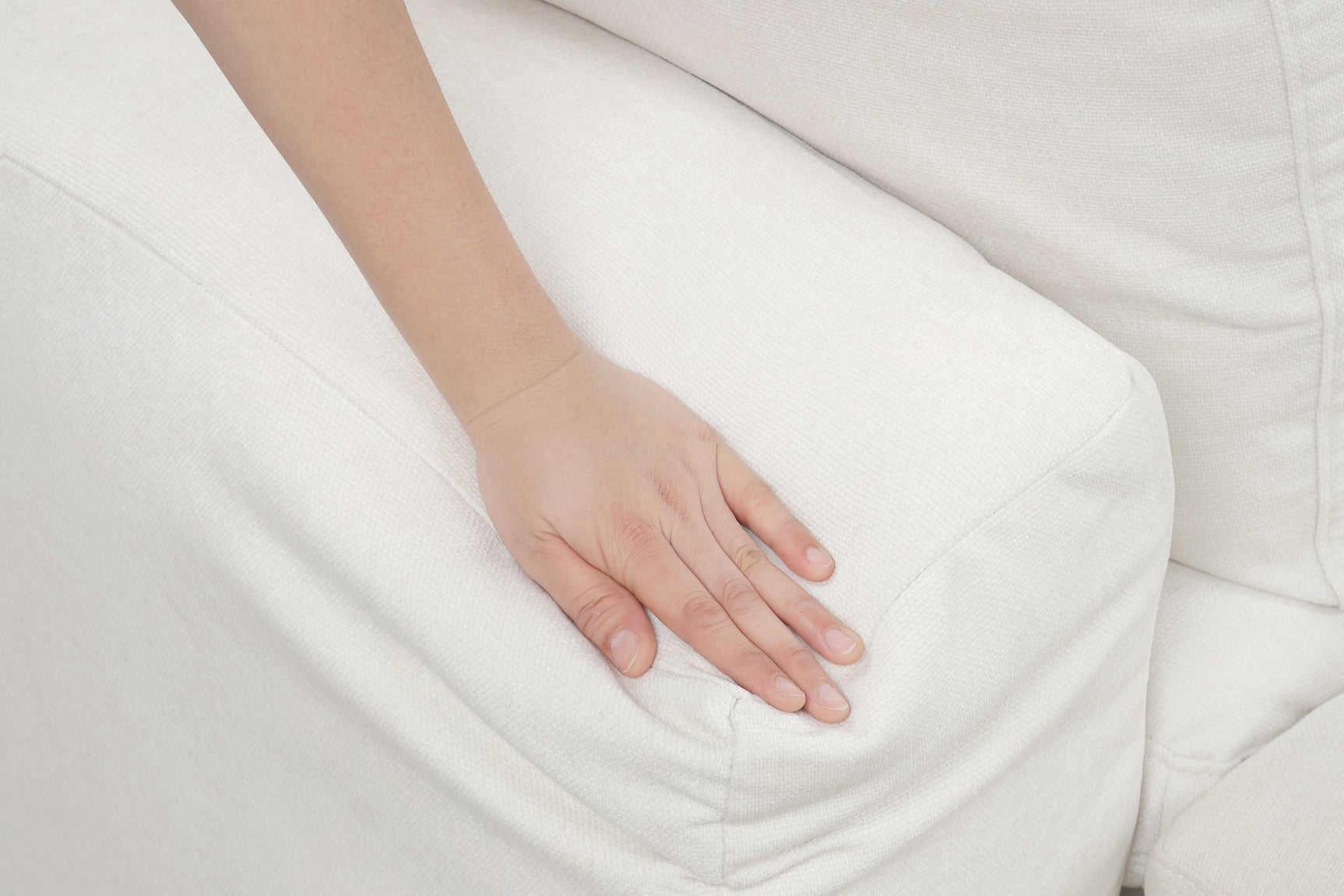 Detailed view of the beige fabric and cushions on Xlcloud sectional