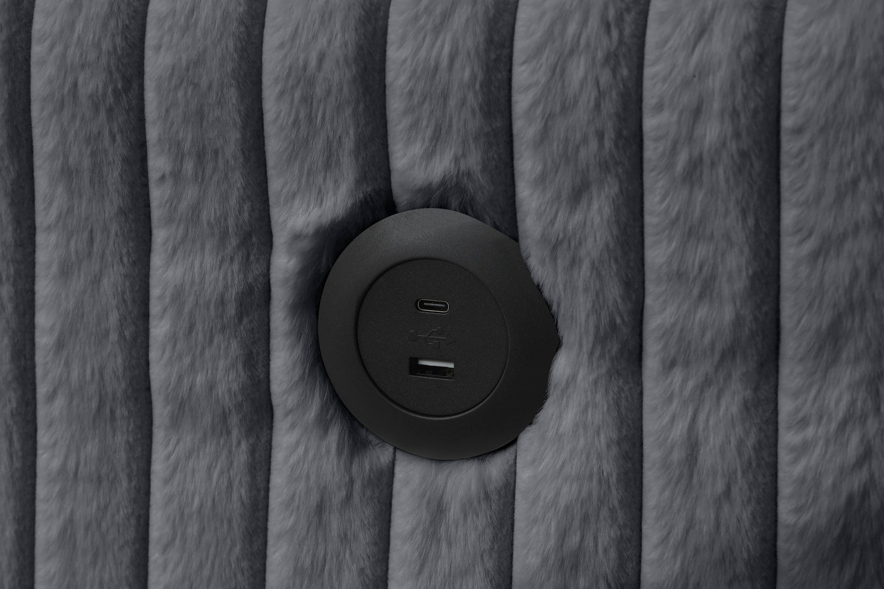 Close-up detail of charcoal fabric and chaise storage on July Sectional sofa